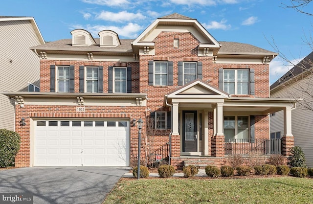 view of front of home featuring a garage and a front yard