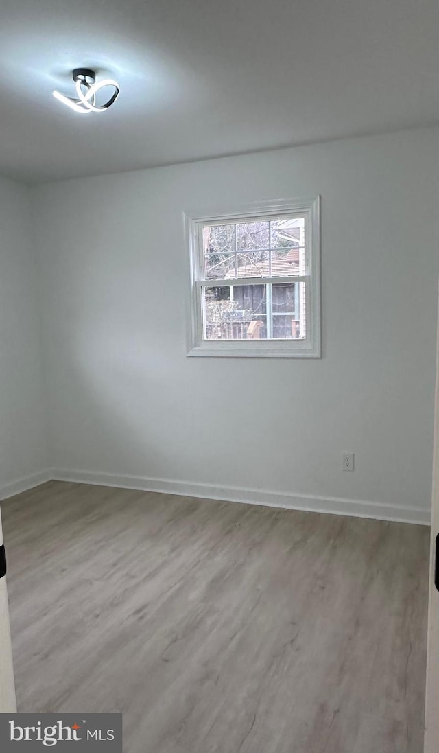 empty room featuring wood-type flooring