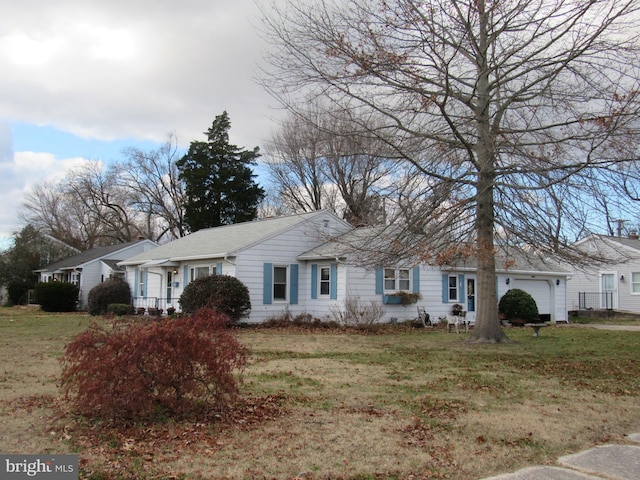 single story home featuring a front yard and a garage