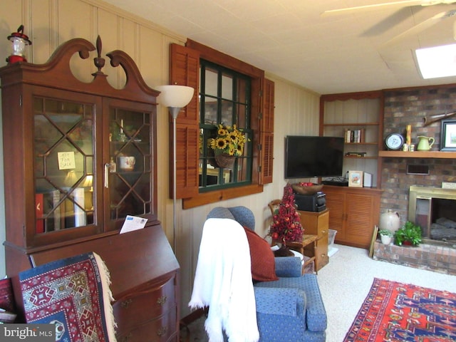 carpeted living room with a fireplace