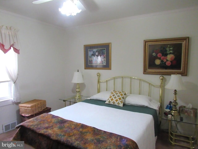 bedroom featuring ceiling fan and crown molding