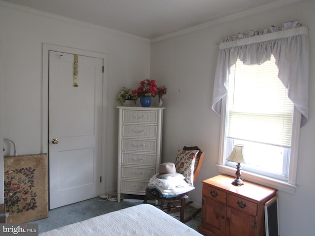 carpeted bedroom featuring ornamental molding