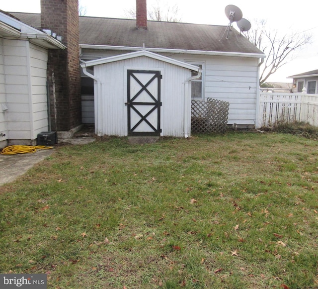 view of outdoor structure featuring a lawn