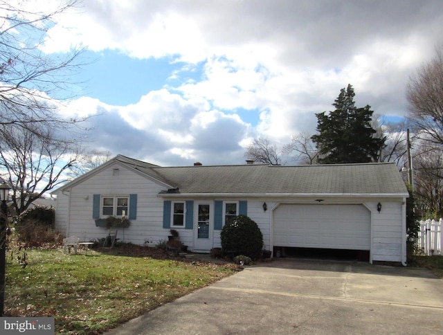 ranch-style house with a garage and a front lawn