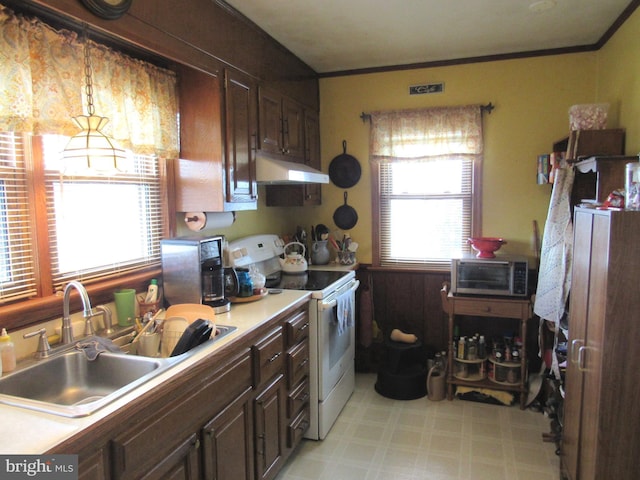 kitchen with ornamental molding, sink, pendant lighting, and white electric range