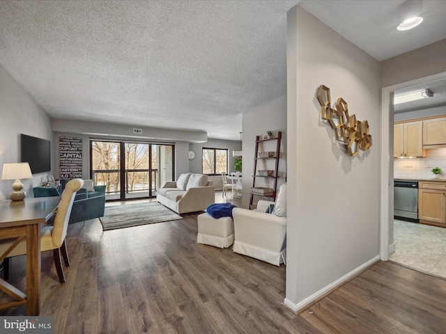 living room featuring a textured ceiling and dark hardwood / wood-style floors