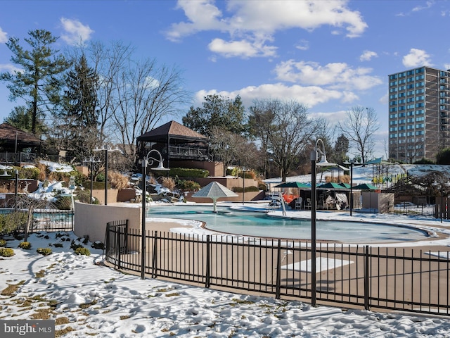 snow covered pool with a gazebo