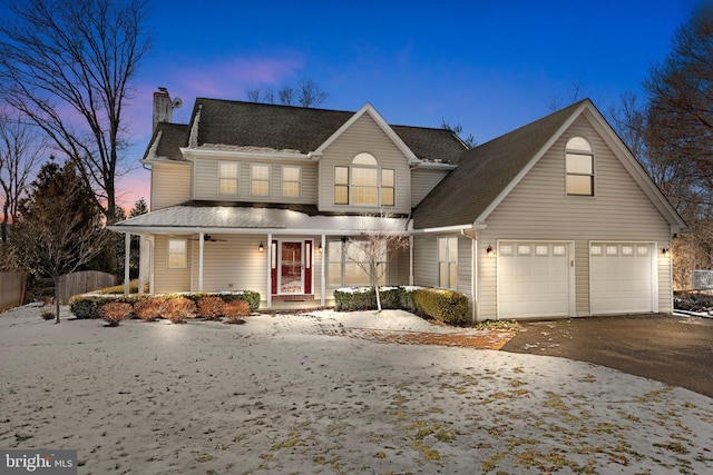 view of front of house with a porch and a garage