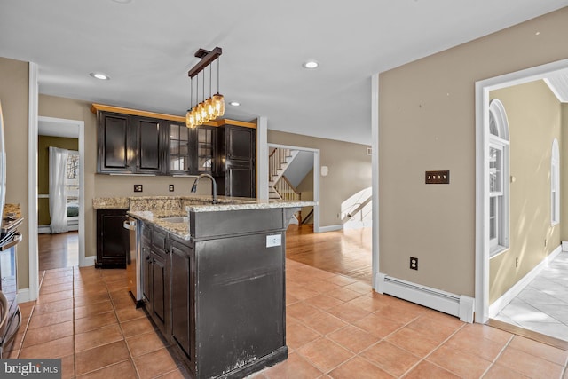 kitchen featuring a center island, baseboard heating, decorative light fixtures, dark brown cabinets, and light tile patterned floors