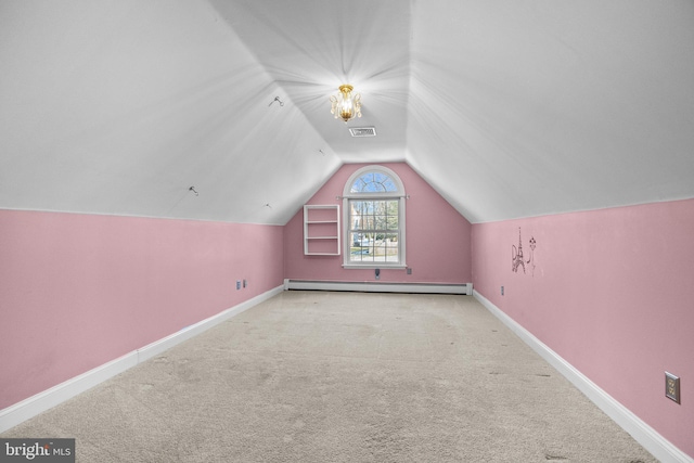 bonus room featuring light colored carpet, lofted ceiling, and a baseboard heating unit