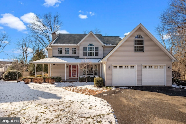 front facade with a porch and a garage