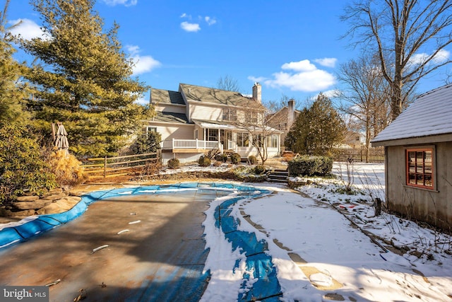 view of snow covered pool