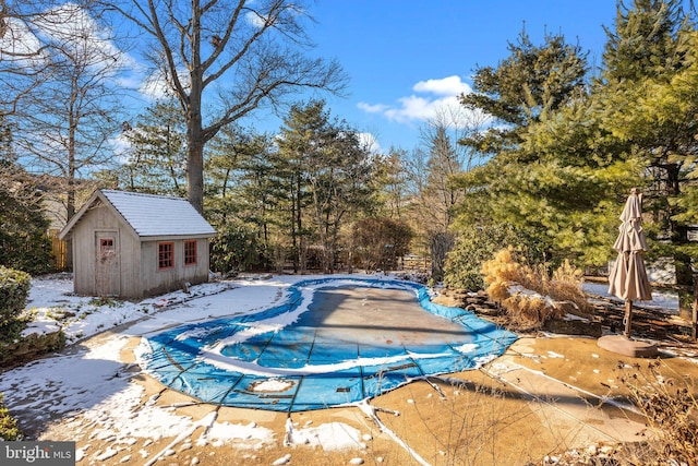 view of pool with an outdoor structure