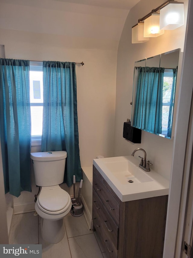 bathroom featuring vanity, toilet, and tile patterned floors