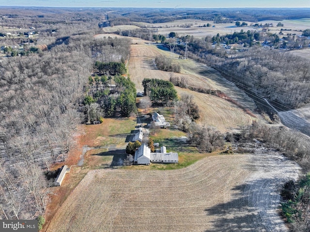 birds eye view of property with a rural view