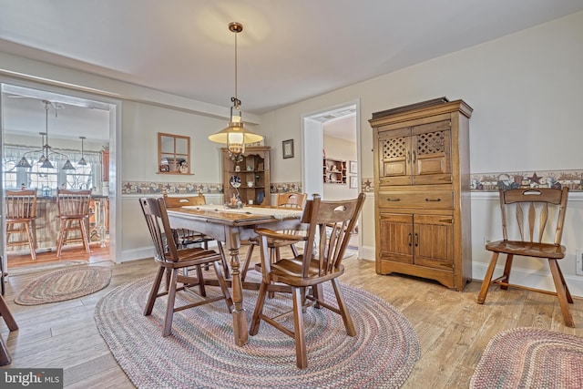 dining room with light wood-type flooring