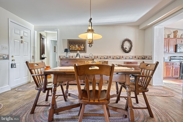 dining room featuring light hardwood / wood-style floors