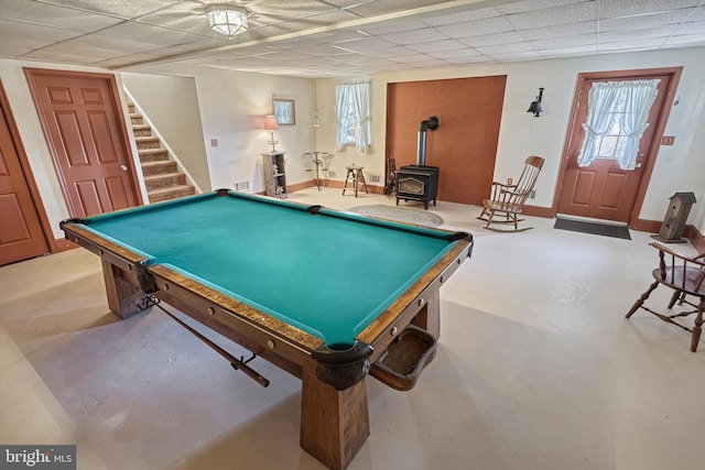 rec room featuring a wood stove and billiards