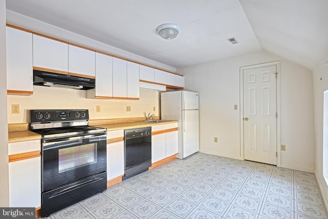 kitchen featuring white cabinetry, sink, black appliances, and vaulted ceiling