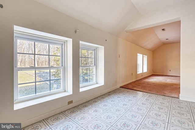 additional living space with vaulted ceiling