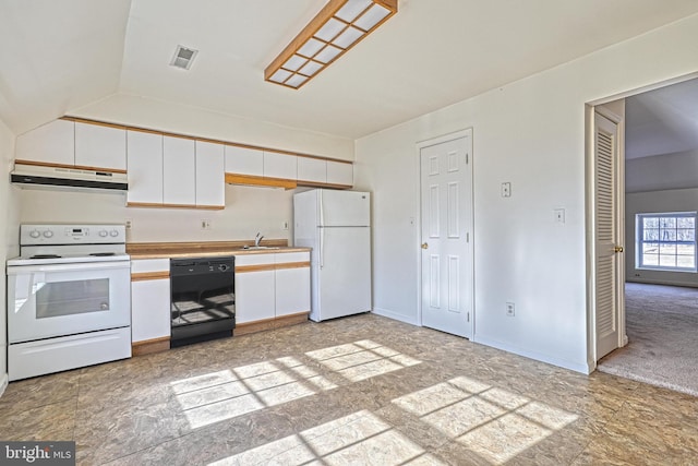 kitchen with white appliances, light colored carpet, vaulted ceiling, sink, and white cabinets