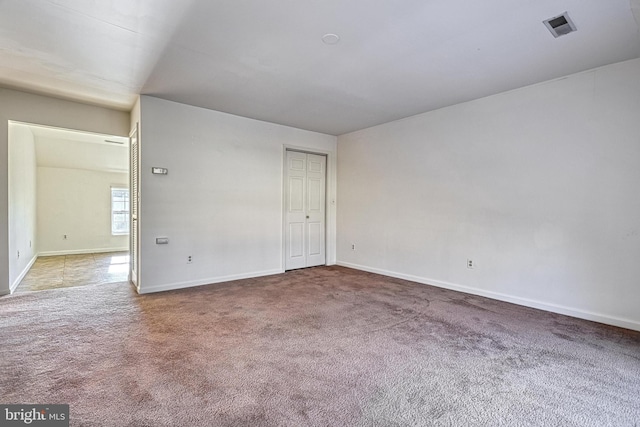 unfurnished room with carpet