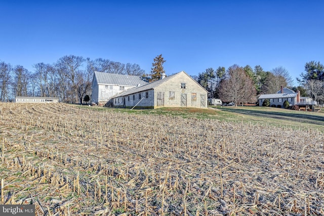 view of property exterior featuring a lawn