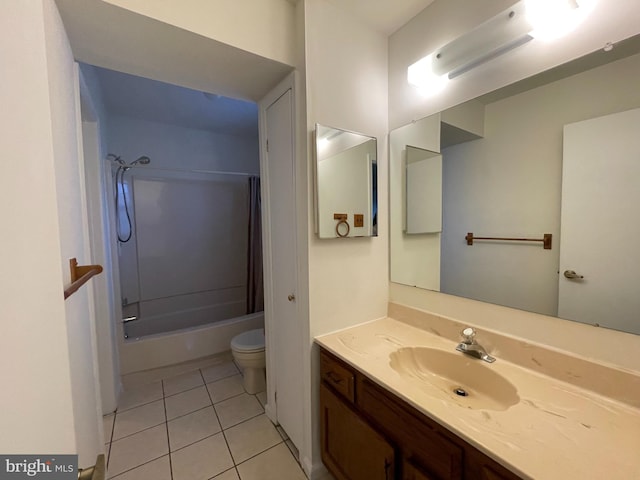 full bathroom featuring toilet, vanity, tile patterned floors, and washtub / shower combination