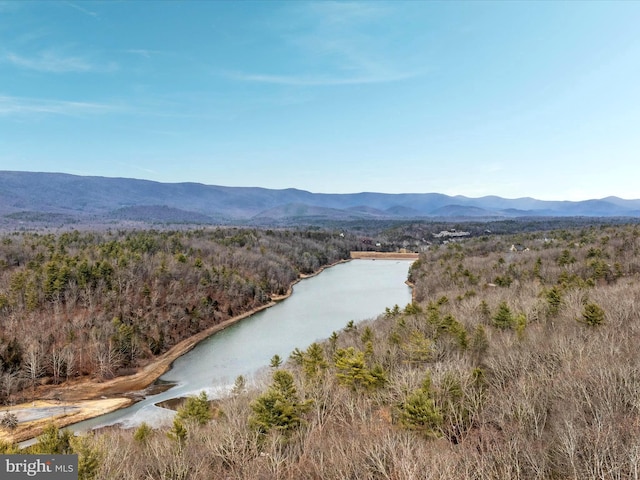 aerial view featuring a water and mountain view