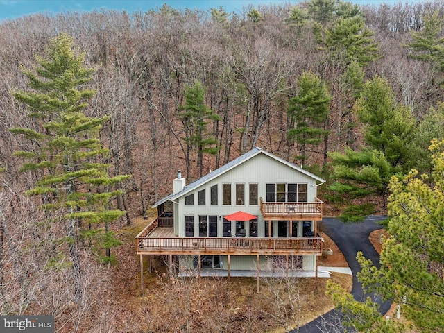 back of house with a wooden deck