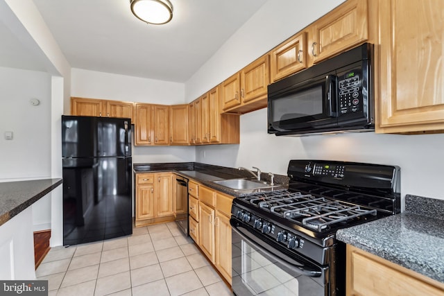 kitchen featuring light tile patterned floors, sink, and black appliances