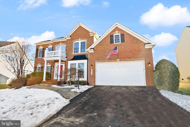 view of front of property with a garage and a balcony