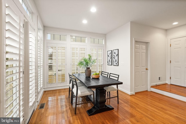 dining area featuring light wood-type flooring