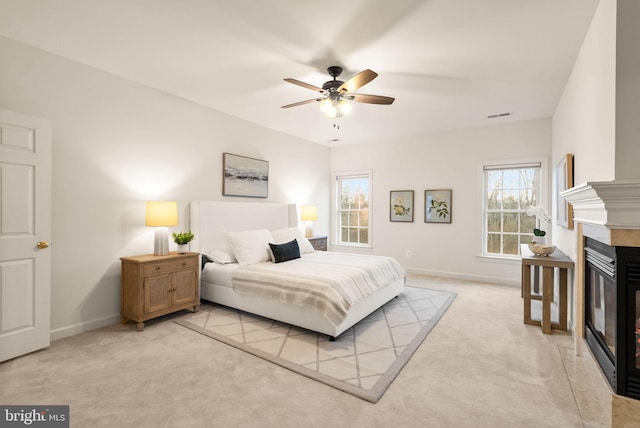 carpeted bedroom with ceiling fan