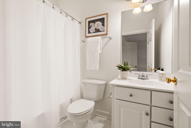 bathroom with walk in shower, tile patterned floors, vanity, and toilet