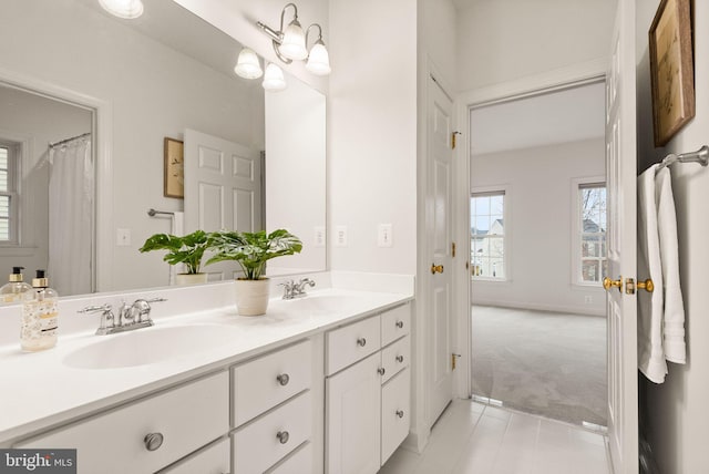 bathroom featuring vanity and a notable chandelier