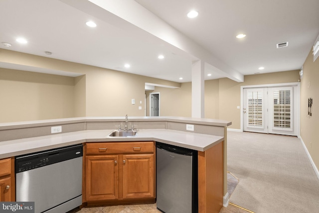 kitchen featuring dishwasher, fridge, sink, and light carpet