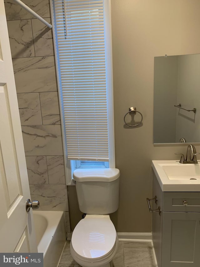 bathroom with tile patterned floors, vanity, and toilet