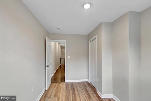 corridor featuring light hardwood / wood-style floors