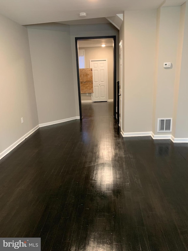 spare room featuring dark hardwood / wood-style floors