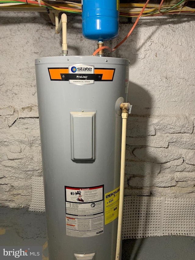 utility room with electric water heater