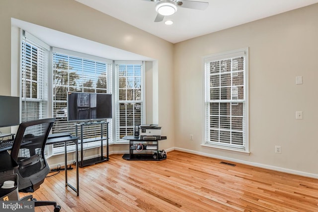 office space featuring hardwood / wood-style floors and ceiling fan