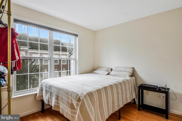 bedroom with wood-type flooring