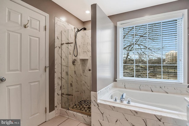 bathroom featuring separate shower and tub, tile patterned floors, and plenty of natural light