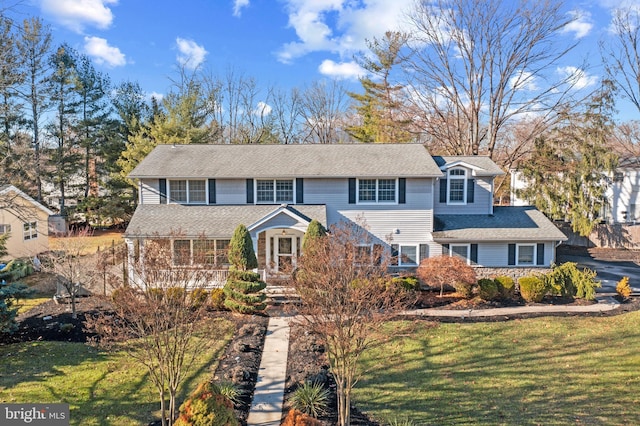 view of property with a front lawn