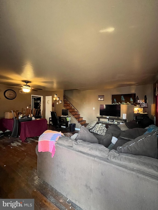 living room with ceiling fan and hardwood / wood-style flooring