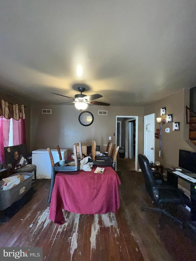 dining room with ceiling fan and dark hardwood / wood-style flooring