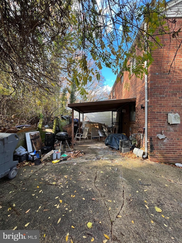 view of side of property with a carport