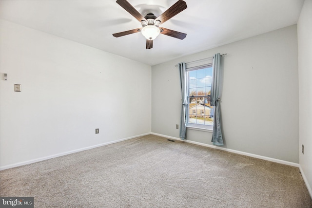 empty room featuring carpet and ceiling fan