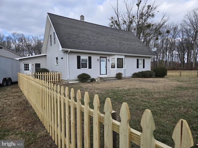 view of front of property with a front lawn